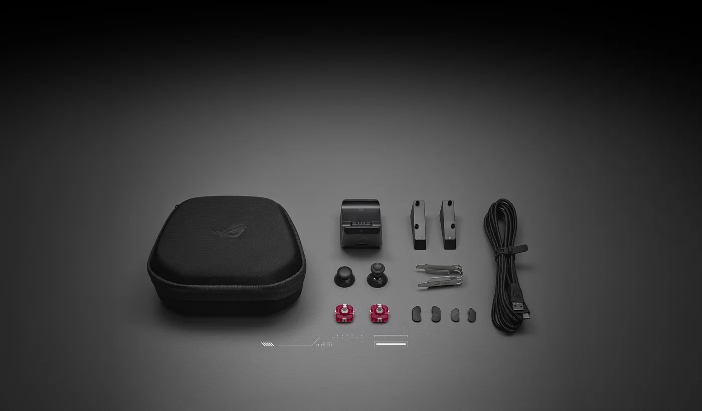 De doosinhoud van de ROG Raikiri II Pro PC: case, oplaadstandaard, kabel, stickmodules, kappen en afdekplaatjes